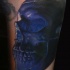 Realism style awesome colored human skull tattoo