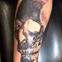 realism style black ink forearm tattoo of big human skull