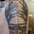 Realism style black ink old railway station photo tattoo on upper arm