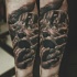 Realism style colored arm tattoo of screaming human face with hands
