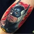 Realism style colored arm tattoo of Batman face