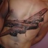 Realism style colored chest and belly tattoo of large bomber plane