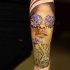Realism style colored forearm tattoo of woman with flowers
