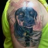 Realism style colored shoulder tattoo of hunters dog with ducks
