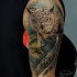 Realism style colored shoulder tattoo of owl with detailed compass