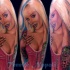 Realism style colored shoulder tattoo of seductive woman