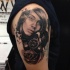 Realism style colored shoulder tattoo of  woman with gas mask