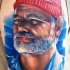 Realism style colored shoulder tattoo of old man with beard