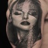 Realism style colored shoulder tattoo of seductive woman face