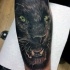 Realism style colored tattoo of black panther