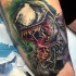 Realism style colored tattoo of very detailed evil Venom