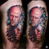 Realism style colored thigh tattoo of famous actor with pistol