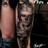Realism style colored thigh tattoo of evil man with makeup