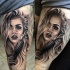 Realism style colored thigh tattoo of woman with pistol