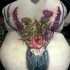 Realism style large colored back tattoo of deer skull and wildflowers