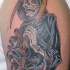 Realistic grim reaper tattoo on shoulder