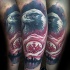 Realistic looking arm tattoo of eagle with city sights and emblem