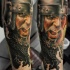 Realistic looking colored arm tattoo of medieval warrior