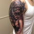 Realistic looking colored shoulder tattoo of seductive woman with mask
