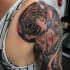 Realistic looking colored shoulder tattoo of tiger with samurai warrior
