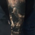 Realistic looking colored tattoo of creepy demon skull