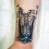 Realistic looking forearm tattoo of broken bulb