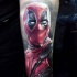 Realistic looking lifelike arm tattoo of Deadpool