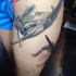 Realistic looking thigh tattoo of WW2 plane