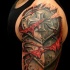 Ripped skin style colored shoulder tattoo of medieval iron armor