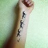 Running horses tattoo on hand