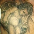 CHERUBINO TRISTE CON CRANIO TATUAGGIO