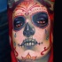 Tatuaje en el antebrazo, la santa muerte con lágrimas