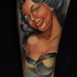 Seductive smiling brunette pin up girl colored old school style tattoo