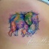 Sentimental mother and baby elephant colored tattoo on woman's side in watercolor style by Javi Wolf