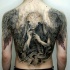 Shaman and wings tattoo on back