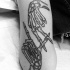 Simple black ink arm tattoo of human skeleton hands