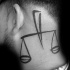 Simple black ink head tattoo of medium size libra