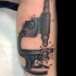 Simple engraving style leg tattoo of vintage microscope