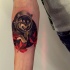 Simple illustrative style forearm tattoo of wolf astronaut
