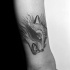 Simple sketch style arm tattoo of evil fox head