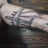 Sketch like black ink biceps tattoo of big flying passenger plane