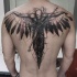 Sketch style black ink upper back tattoo of fantasy human with clock