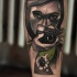 Sketch style colored arm tattoo of woman with camera and bug