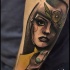 Sketch style colored arm tattoo of woman with big flower