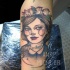 Sketch style colored arm tattoo of woman with birds and rats
