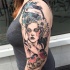 Sketch style colored shoulder tattoo of beautiful woman with various animals and flowers