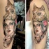 Sketch style colored shoulder tattoo of tribal woman with wolf helmet