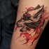 Sketch style colored thigh tattoo of tribal woman with wolf head