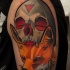 Tatuaggio colorato sul deltoide la volpe con il teschio