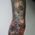 Skull and lady tattoo on arm by graynd